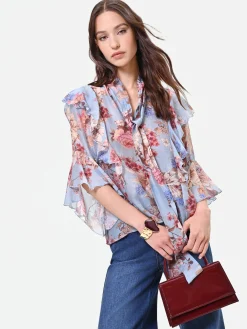 BLUSA AZZURRA CON FANTASIA FLOREALE E FIOCCO