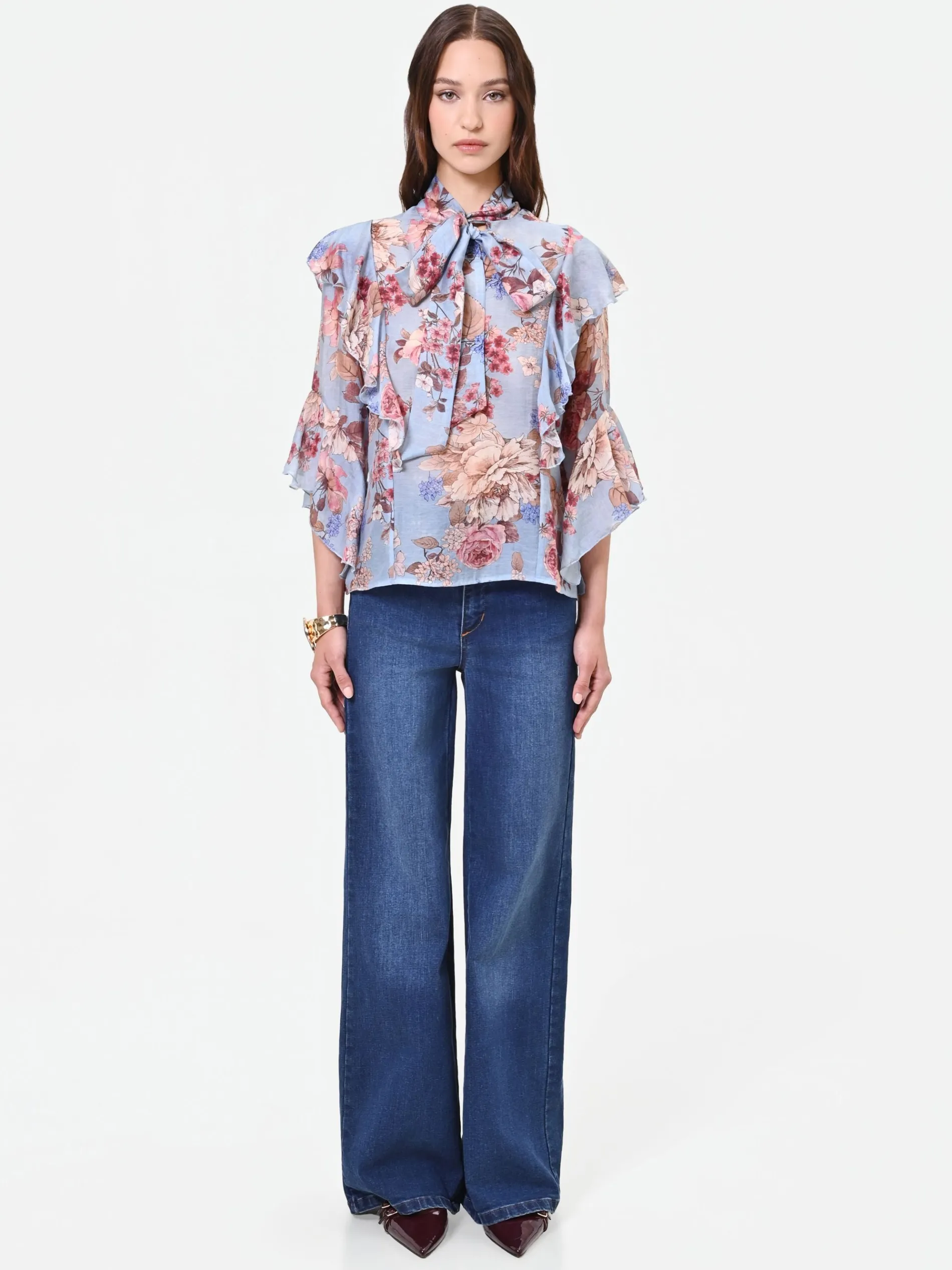 BLUSA AZZURRA CON FANTASIA FLOREALE E FIOCCO