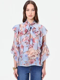 BLUSA AZZURRA CON FANTASIA FLOREALE E FIOCCO