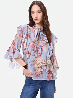 BLUSA AZZURRA CON FANTASIA FLOREALE E FIOCCO