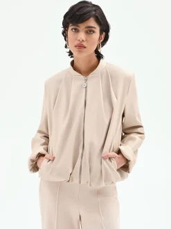BOMBER IN SIMILPELLE TORTORA BEIGE CON MANICHE A PALLONCINO