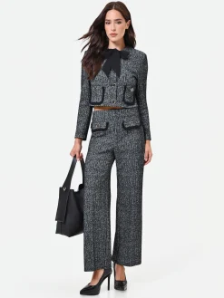 PANTALONE NERO IN BOUCLÉ CON TASCHE A TOPPA