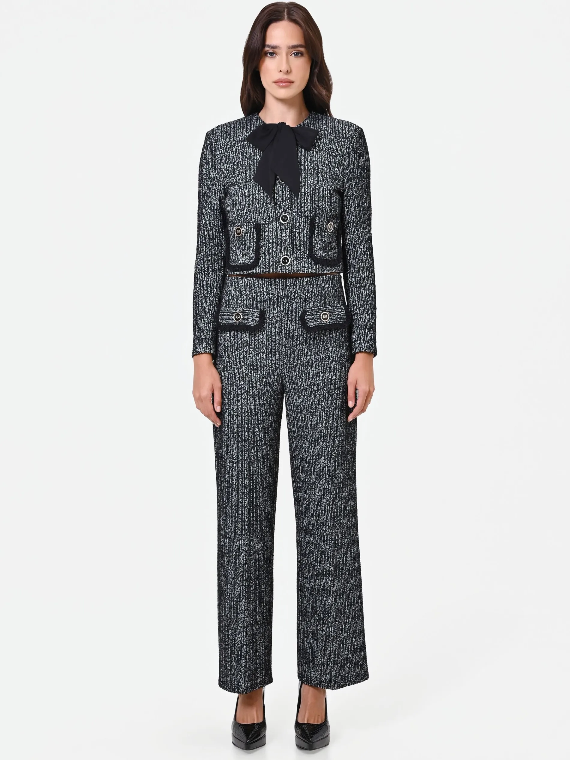 PANTALONE NERO IN BOUCLÉ CON TASCHE A TOPPA