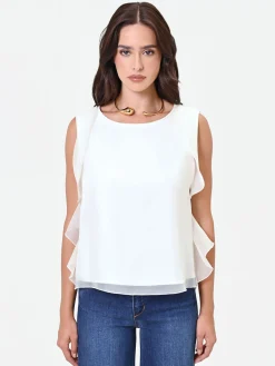 TOP BIANCO CON VOLANT SUI GIROMANICA