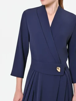 TUTA BLU CON BOTTONE DESIGN